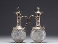 Pair of Baccarat crystal and silver wine decanters.