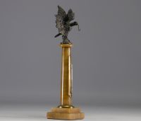 Watch and thermometer holder on marble column surmounted by an eagle in regula, late 19th century.