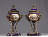 Pair of Sèvres porcelain cassolettes decorated with gallant scenes, mounted on bronze.