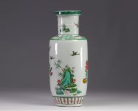 China - A green family porcelain vase decorated with trees and birds, early 20th century.