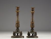 A pair of candlesticks in bronze with a double patina from the Charles X period.