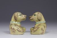 China - pair of glazed porcelain dogs with green collars.