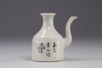 China - Famille rose porcelain teapot decorated with characters.