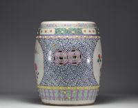 China - A famille rose porcelain stool decorated with peonies and birds in cartouches, circa 1900
