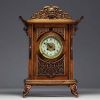 Carved exotic wood clock in the style of Gabriel Viardot with chinoisant decoration, elephant head feet, 19th century.