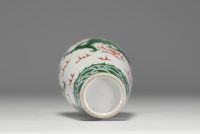 China - A 19th century green family polychrome porcelain vase decorated with a dragon.