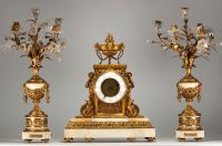 Imposing Louis XVI ormolu and white marble clock and candelabra.