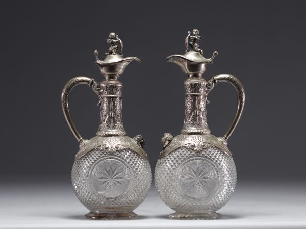 Pair of Baccarat crystal and silver wine decanters.