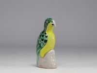 China - Green and yellow glazed ceramic parrot, perched on a rock, Qing period.