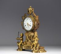 An ormolu and chased clock, allegory of the arts with Putti, dial signed Cherier in Paris, Louis XVI period.