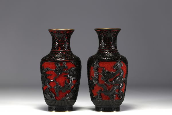 China - A pair of cloisonné vases with figures.