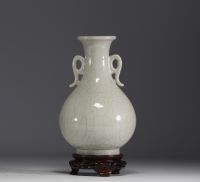 China - Monochrome porcelain vase on wooden base, blue mark under the piece.