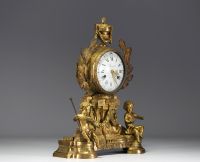 An ormolu and chased clock, allegory of the arts with Putti, dial signed Cherier in Paris, Louis XVI period.