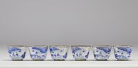 China - set of cloisonné trays and goblets with white-blue decoration of rural scenes and figures, Qing period.