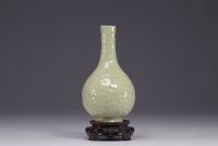 China - Monochrome bottle vase decorated with dragons in relief, Qing period.