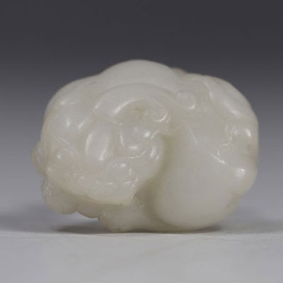 China, carved white jade with Shi Shi decoration, Qing period.