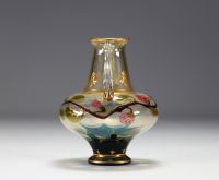 An Art Nouveau vase in glass with gold flower motifs