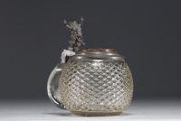 German diamond-point glass tankard with pewter lid featuring a figure.