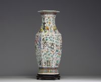 China - A rare pink family polychrome porcelain vase with relief decoration of domestic objects, fruit and floral motifs, hexagonal base, 19th century.