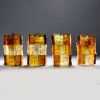 Jean Simon LABRET (20th century) Suite of four Brutalist sconces in orange glass.