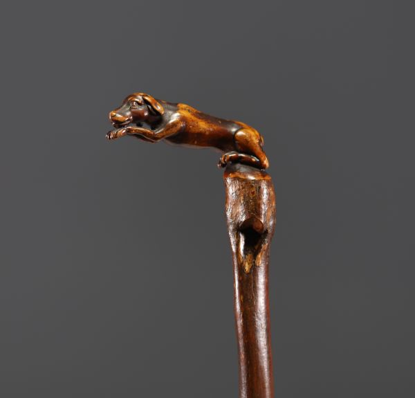 Art Populaire - Carved wooden cane with a dog motif.