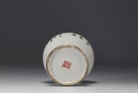 China - Set consisting of a pair of porcelain brush holders and a covered pot, 20th century.