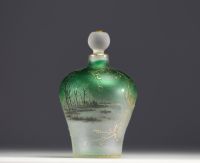 DAUM Nancy - Iridescent glass perfume bottle with enamelled and gold lacustre decoration, signed under the piece.