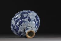 China - Bowl on foot in blue-white porcelain decorated with dragons in waves, Xuande mark.