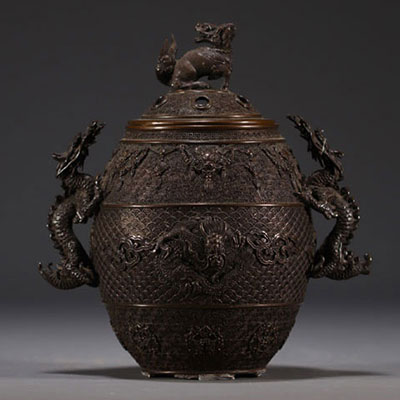 China - Bronze perfume burner decorated with dragons, lid surmounted by a Fô dog.