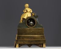 Gilt and patinated bronze clock decorated with Young Girl with Flower Basket, striking movement, Empire period.