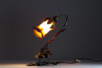 Table lamp, wrought iron base with floral decoration, orange and blue glass paste wick, circa 1900-20.