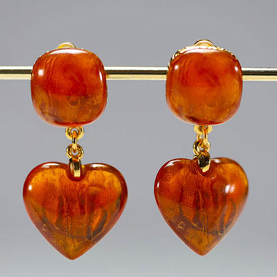 Yves SAINT LAURENT - Pair of heart-shaped earrings, imitation amber and gold-plated metal, signed.