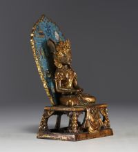 China - A gilt bronze and cloisonné figure of Amitayus from the 18th century.