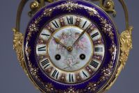 A rare Sèvres porcelain and gilt bronze clock decorated with cherubs.