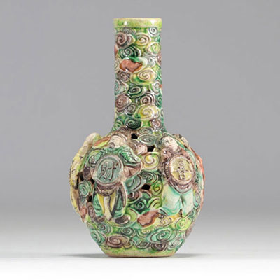 Small vase in relief from the Famille Verte decorated with figures