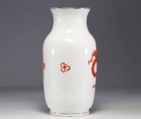 Meissen - Porcelain vase decorated with orange dragons on a white background.