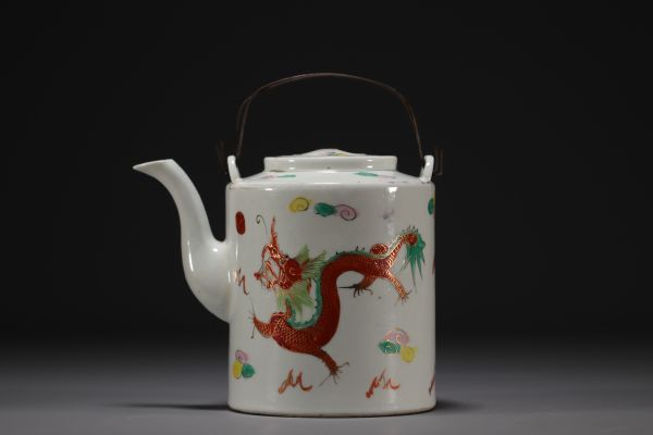 China - Porcelain teapot with dragon design, circa 1900.