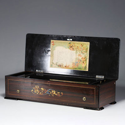 Large cylinder music box with 12 melodies in rosewood veneer and marquetry, Switzerland, 19th century.