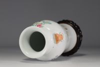 China - Famille rose porcelain vase decorated with traditional furniture and a poem.