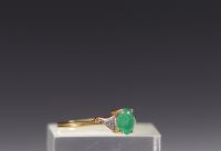 Ring in 18k gold, oval-cut emerald and diamond, total weight 2.2gr