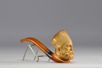 Set of two antique meerschaum pipes with figurative sheaths, 19th century.