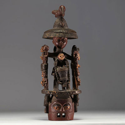 Nigeria - Large, polychromatic Yoruba crest mask with a group of figures.