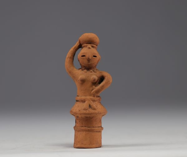 HANIWA. Japanese funerary terracotta depicting a stylized figure, 6th - 9th century.