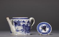 China - A white and blue porcelain teapot decorated with landscapes and a junk, 18th century.