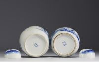 China - Pair of blue-white porcelain covered pots with landscape and figures decoration, mark under the piece.
