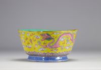 A Famille Rose porcelain bowl decorated with imperial red dragons on a yellow ground with the mark and of the Tao Kuang period (1821-1850)