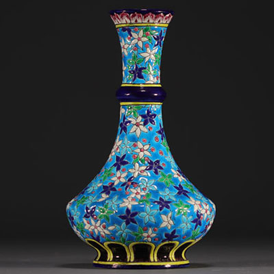 Longwy - Napoleon III earthenware and enamel vase with flowers on an azure blue background, 19th century.