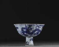 China - Bowl on foot in blue-white porcelain decorated with dragons in waves, Xuande mark.