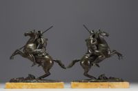 Pair of equestrian sculptures in bronze, figures in the antique style, on a marble base, Charles X period