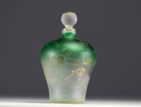 DAUM Nancy - Iridescent glass perfume bottle with enamelled and gold lacustre decoration, signed under the piece.